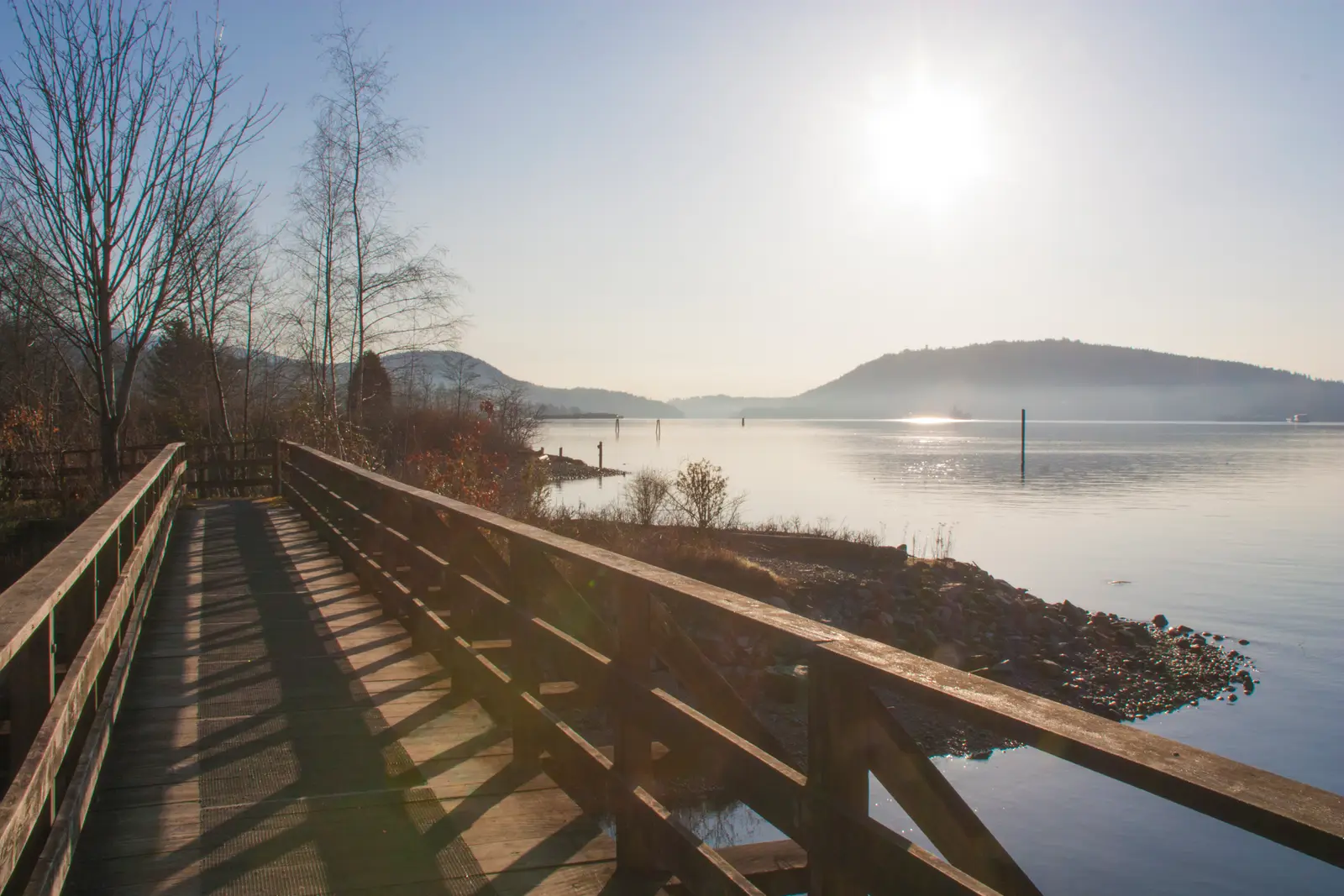 Wooden boardwalk path along Burrard Inlet at Maplewood Flats in North Vancouver